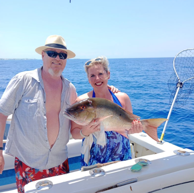 Couple enjoying fishing trip in Nassau