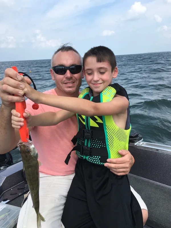 Two people fishing in Lorain with one fish caught