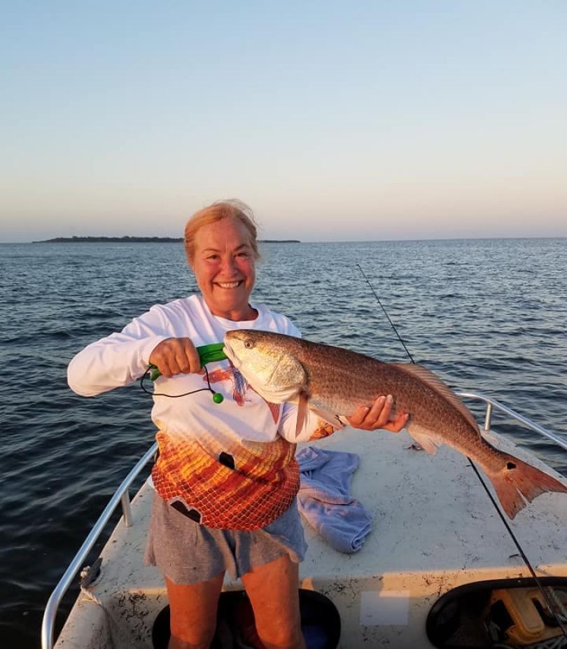 Private fishing charter boat targeting redfish and trout in Cedar Key Florida shallow waters