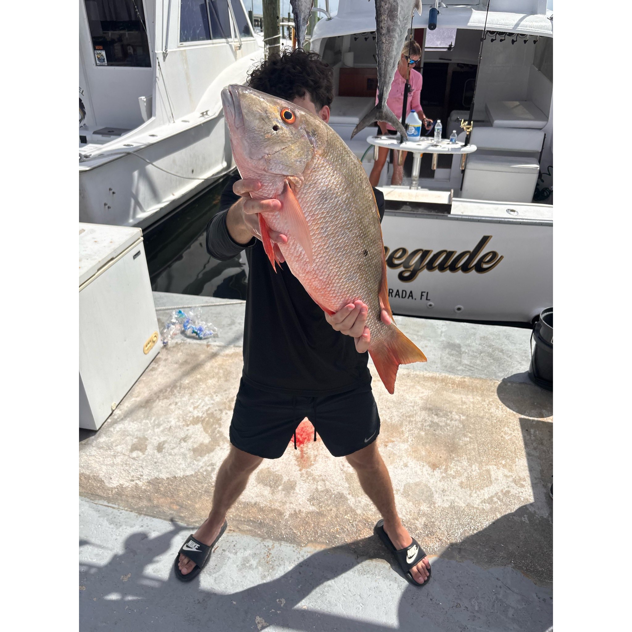 Two mutton snapper and king mackerel fish caught while fishing in Islamorada