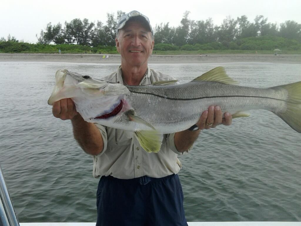 A photograph of a 33-inch snook caught in Jupiter, Florida