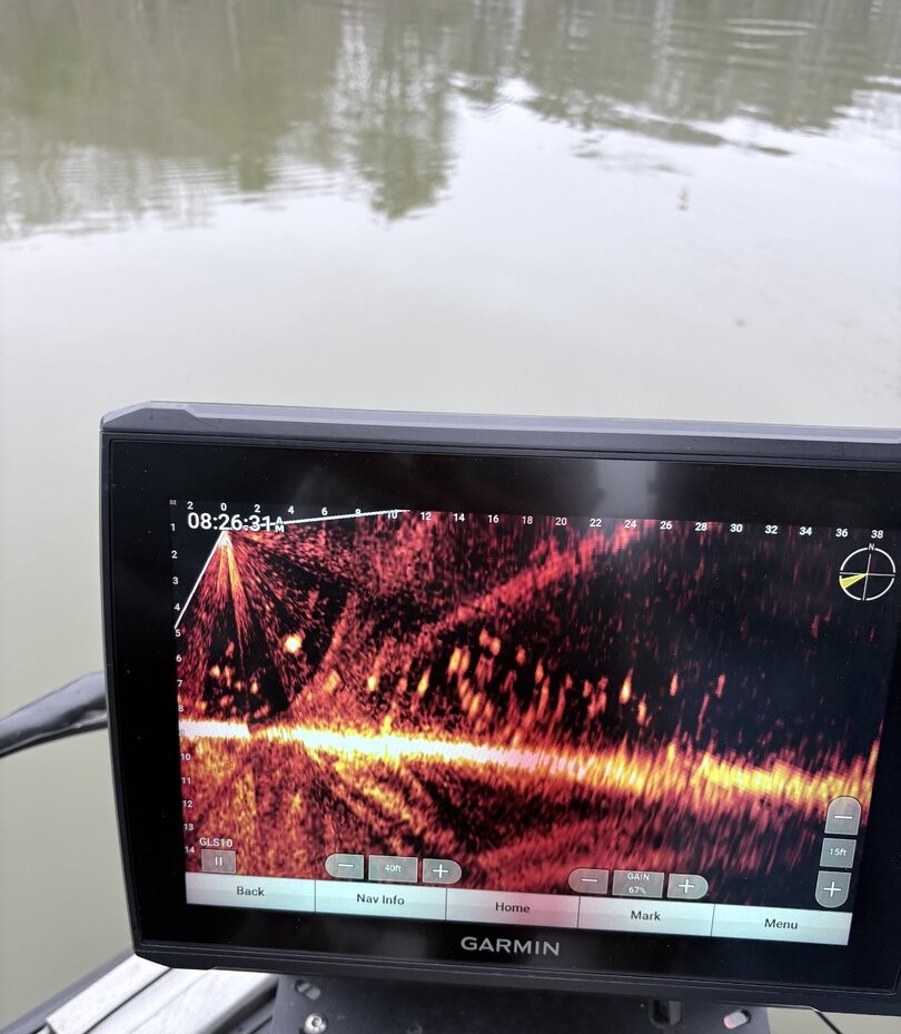 Garmin fish finder display showing sonar reading with fish arches and bottom structure in Gainesville GA waters