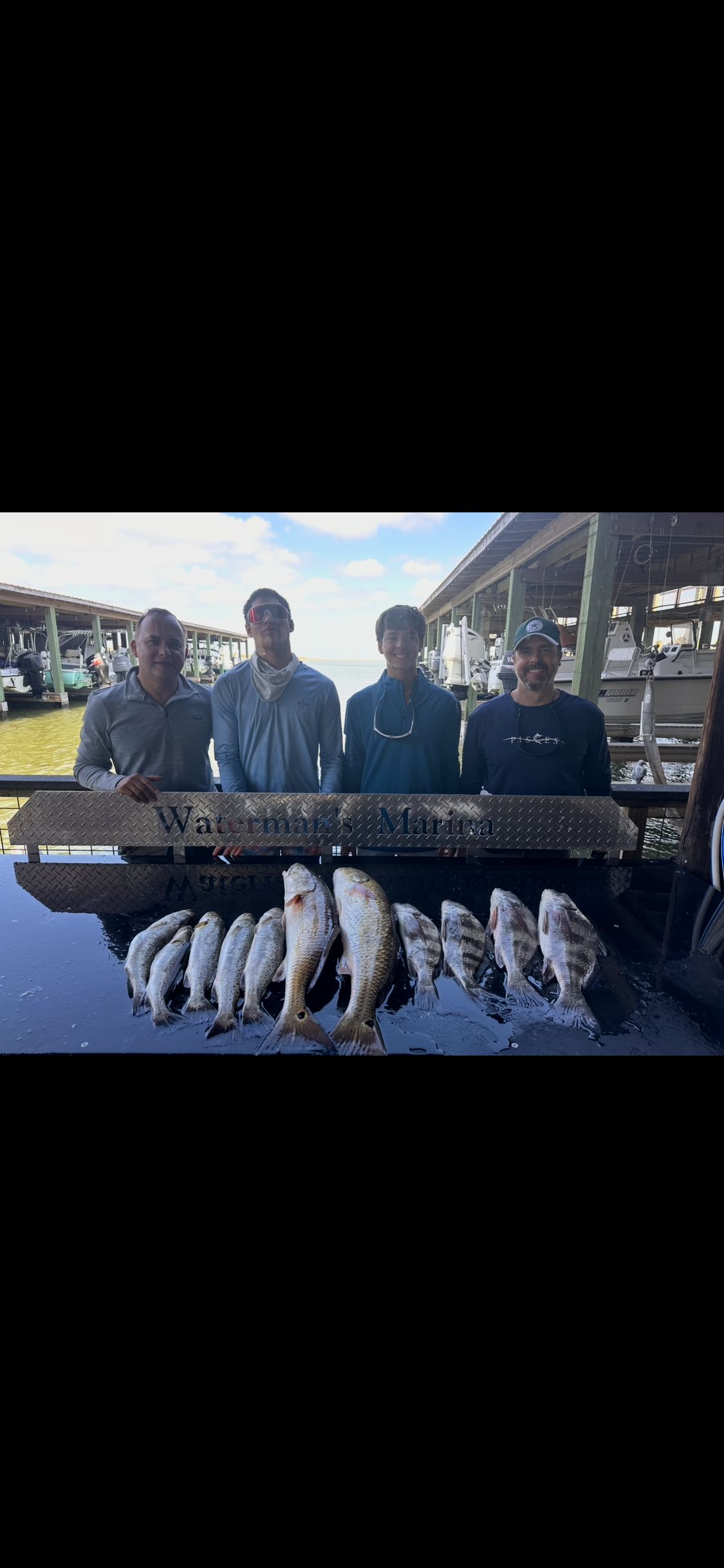 Fresh caught redfish displayed on cleaning table at Galveston TX marina