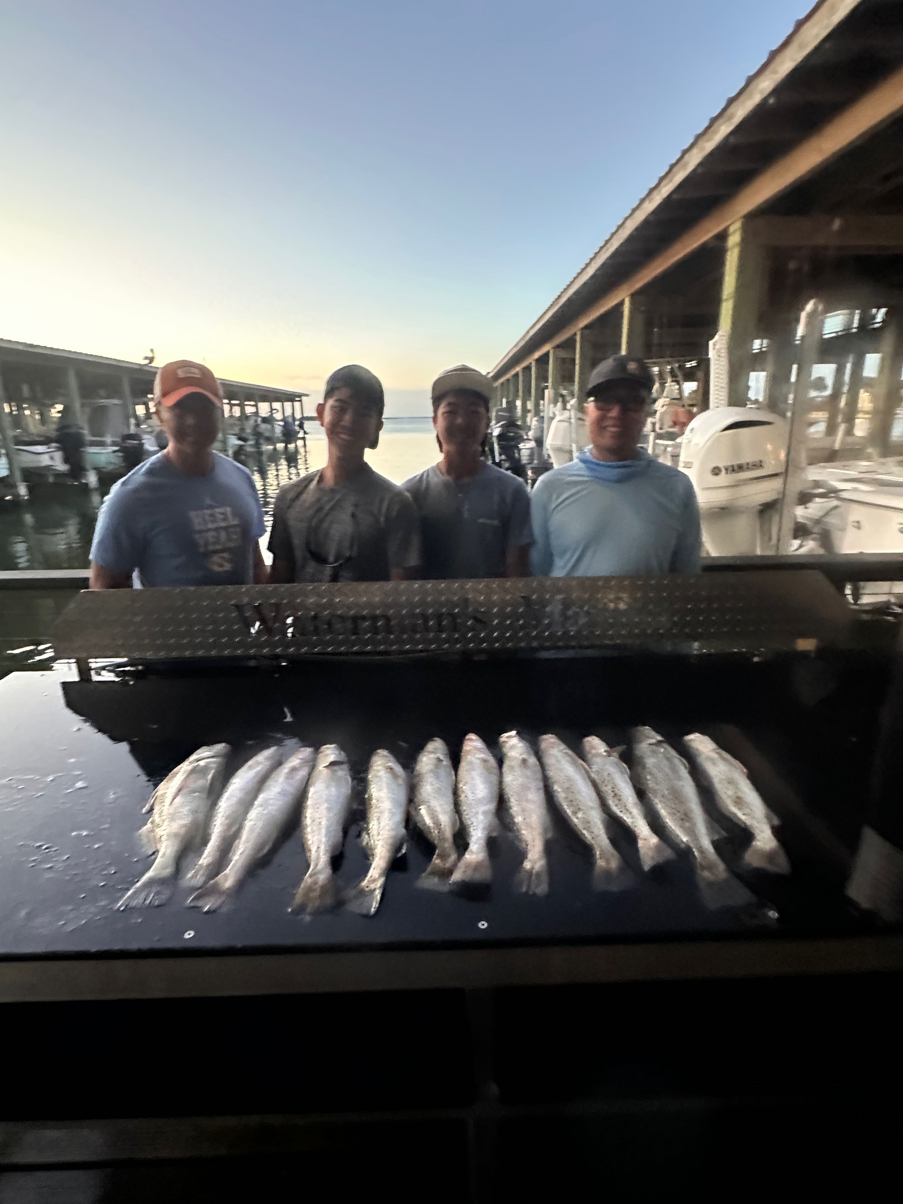 Fresh caught speckled trout displayed on boat cleaning station at Galveston TX marina