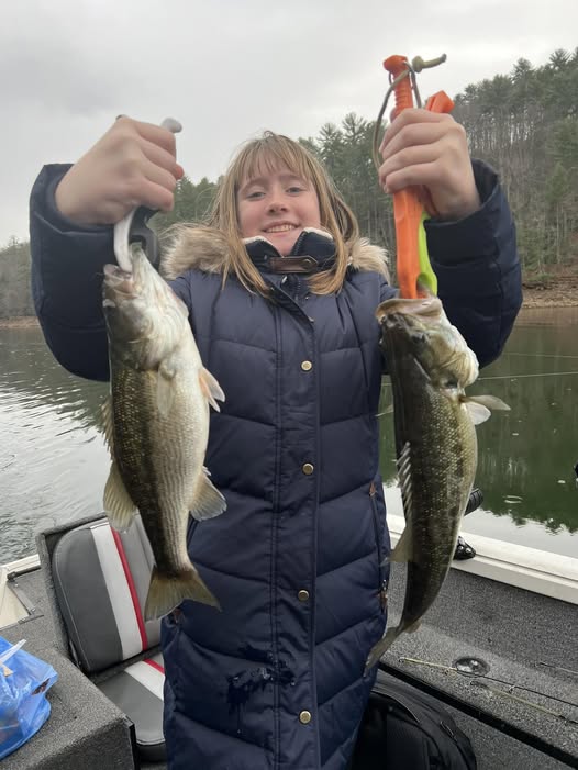 Successful fishing trip in Cumming GA showing two bass caught on the water