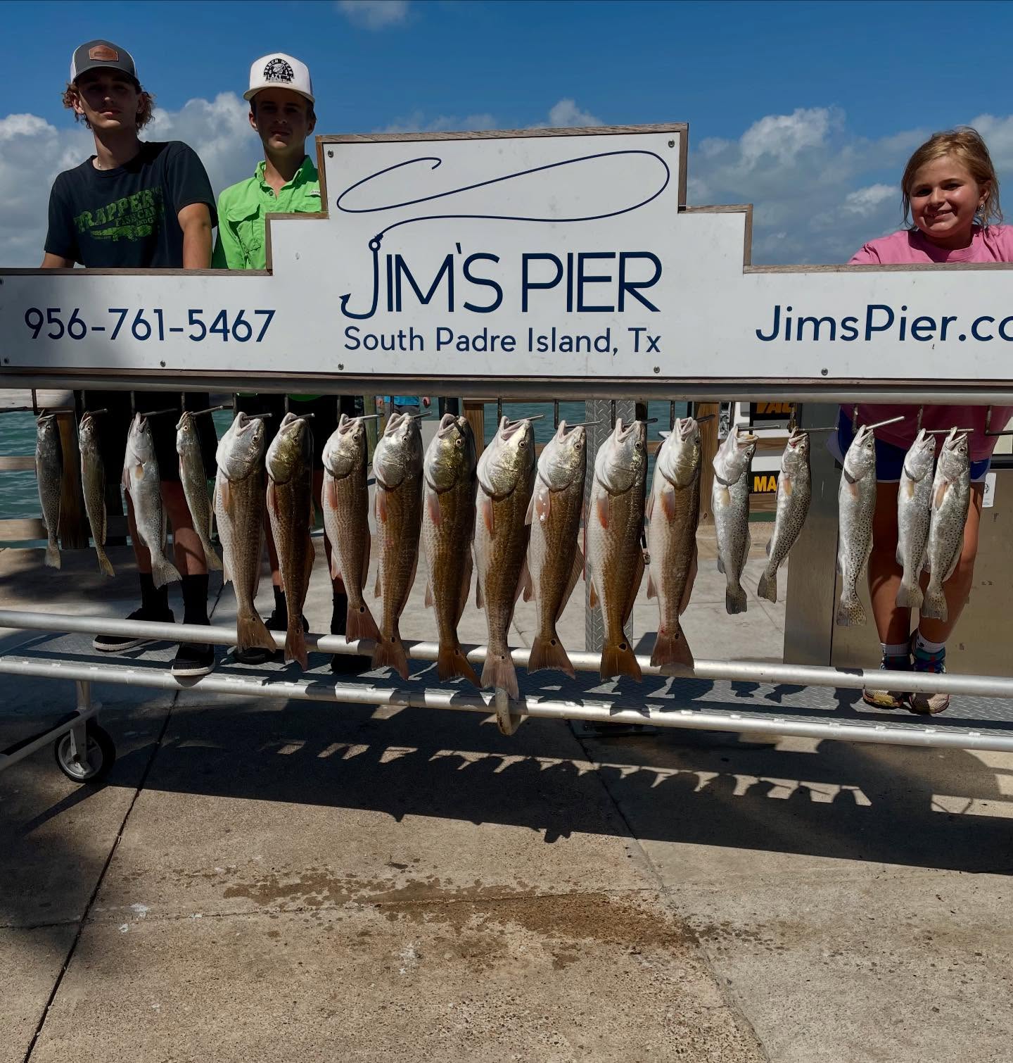 A group of 14 redfish and spotted weakfish caught during a fishing trip at South Padre Island