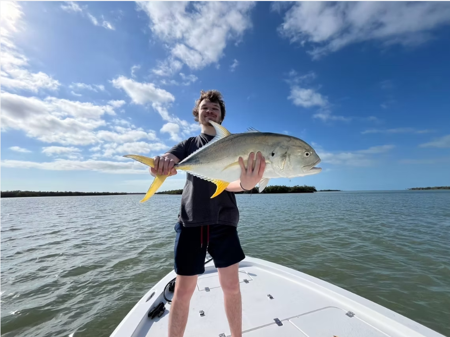 Naples inshore fishing charter boat with anglers targeting snook, tarpon, and redfish