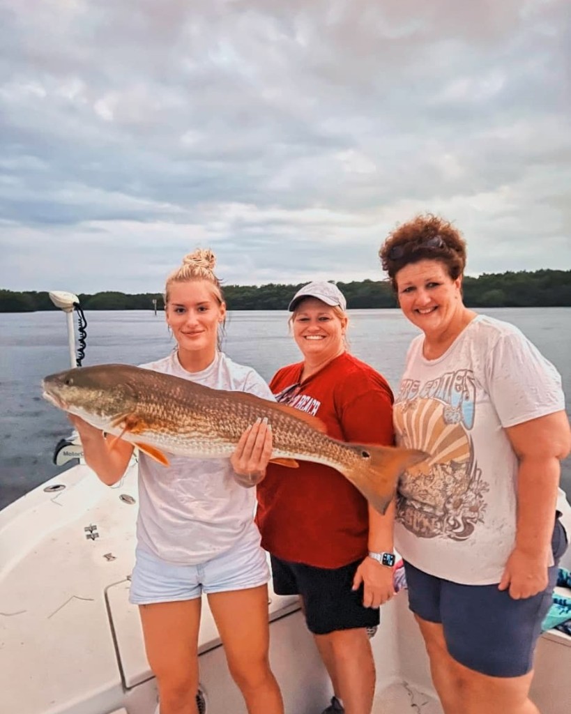Photograph of a redfish (33 inches) caught while fishing in St. Petersburg