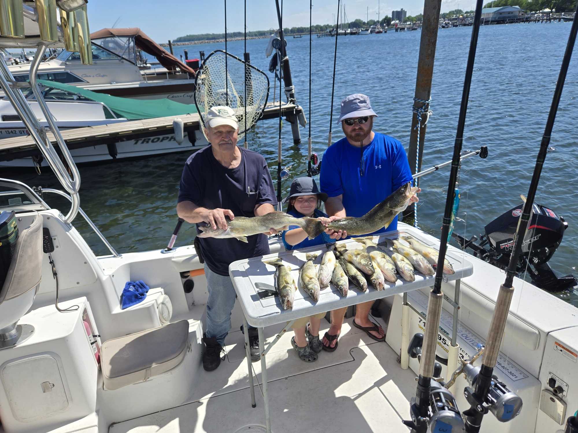 Successful walleye fishing trip in Dunkirk NY with large catch displayed on boat