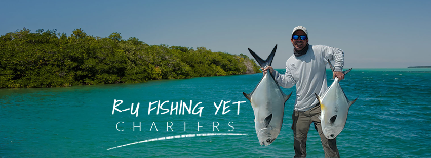 A person fishing with 2 big fish in Key Largo