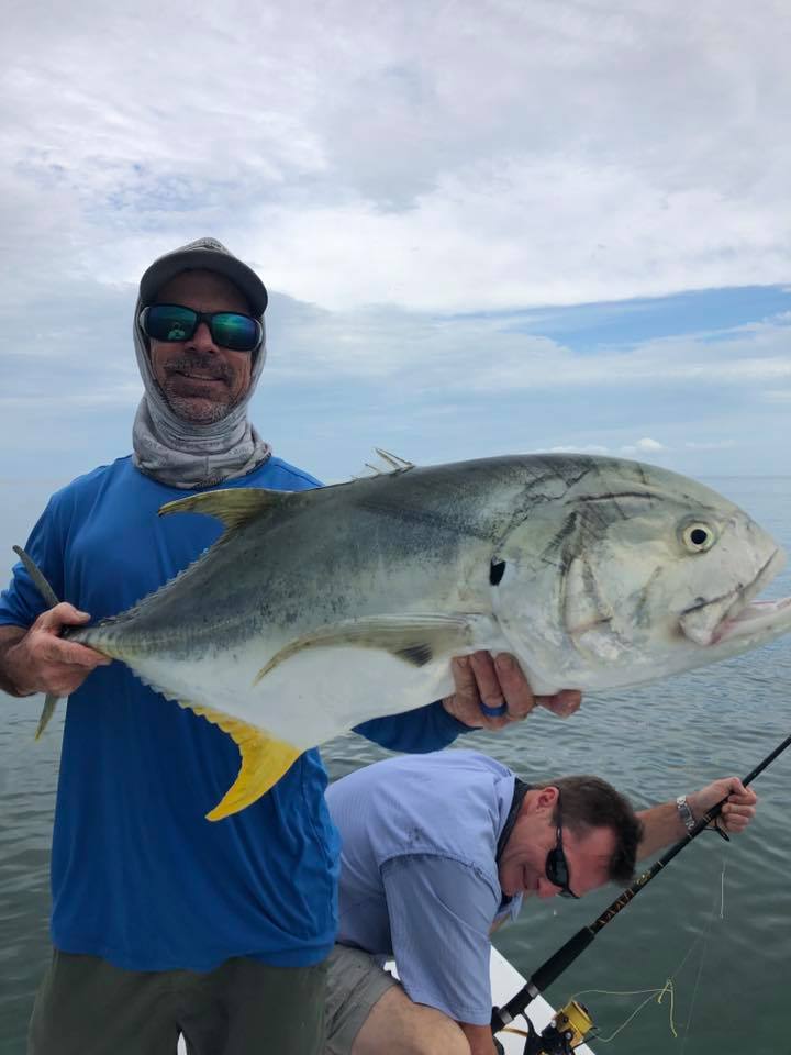 Angler with 28-inch fish on the water in FL