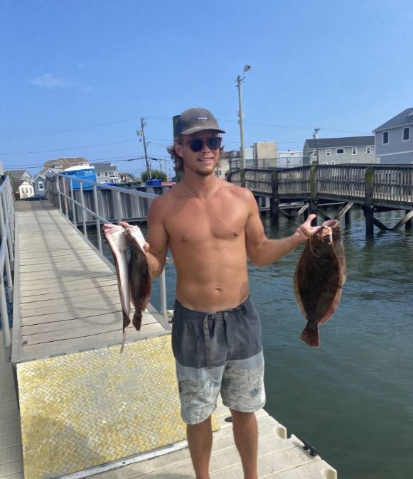 Two fishing rods and a person in NJ