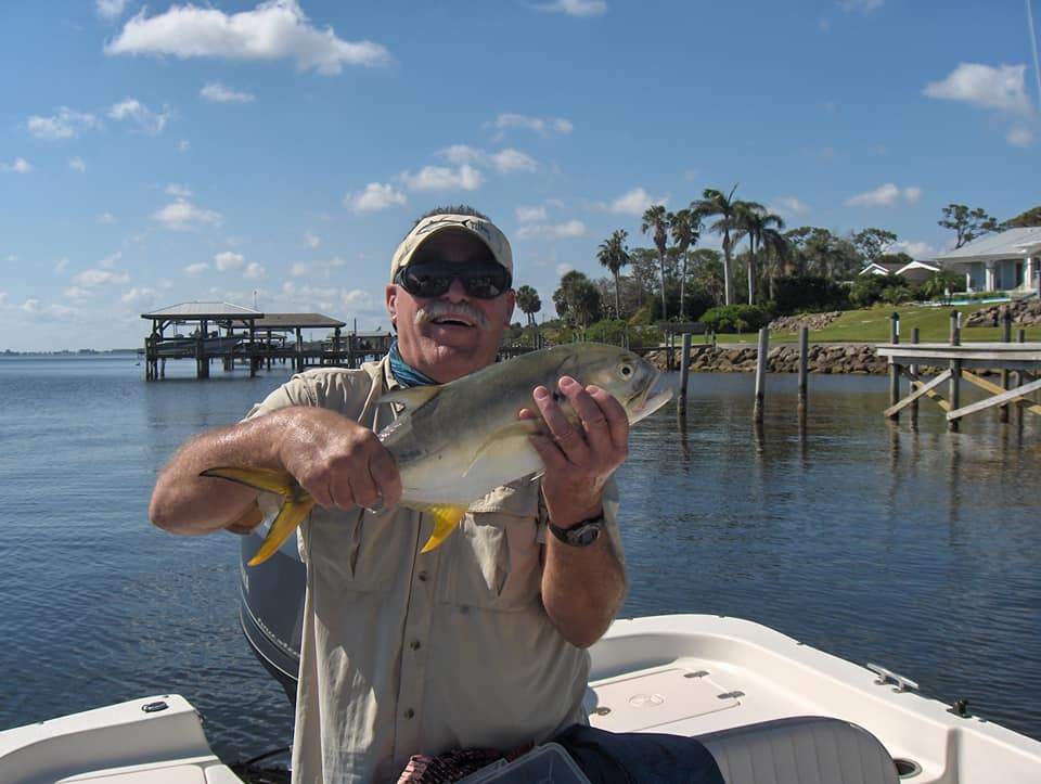 Angler holding a fish in Palm Bay