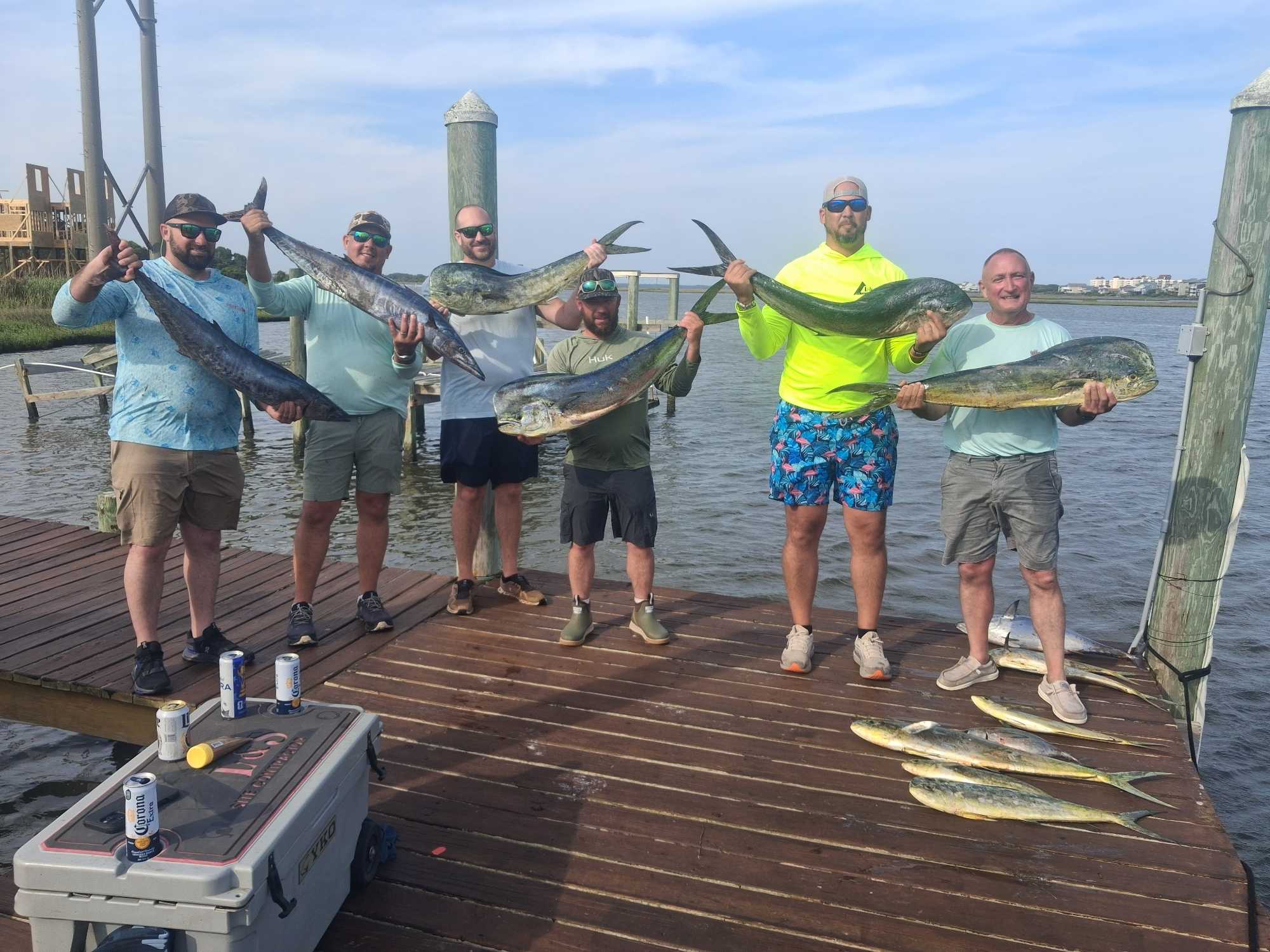 Freshly caught mahi mahi and wahoo displayed on fishing dock in Sneads Ferry NC