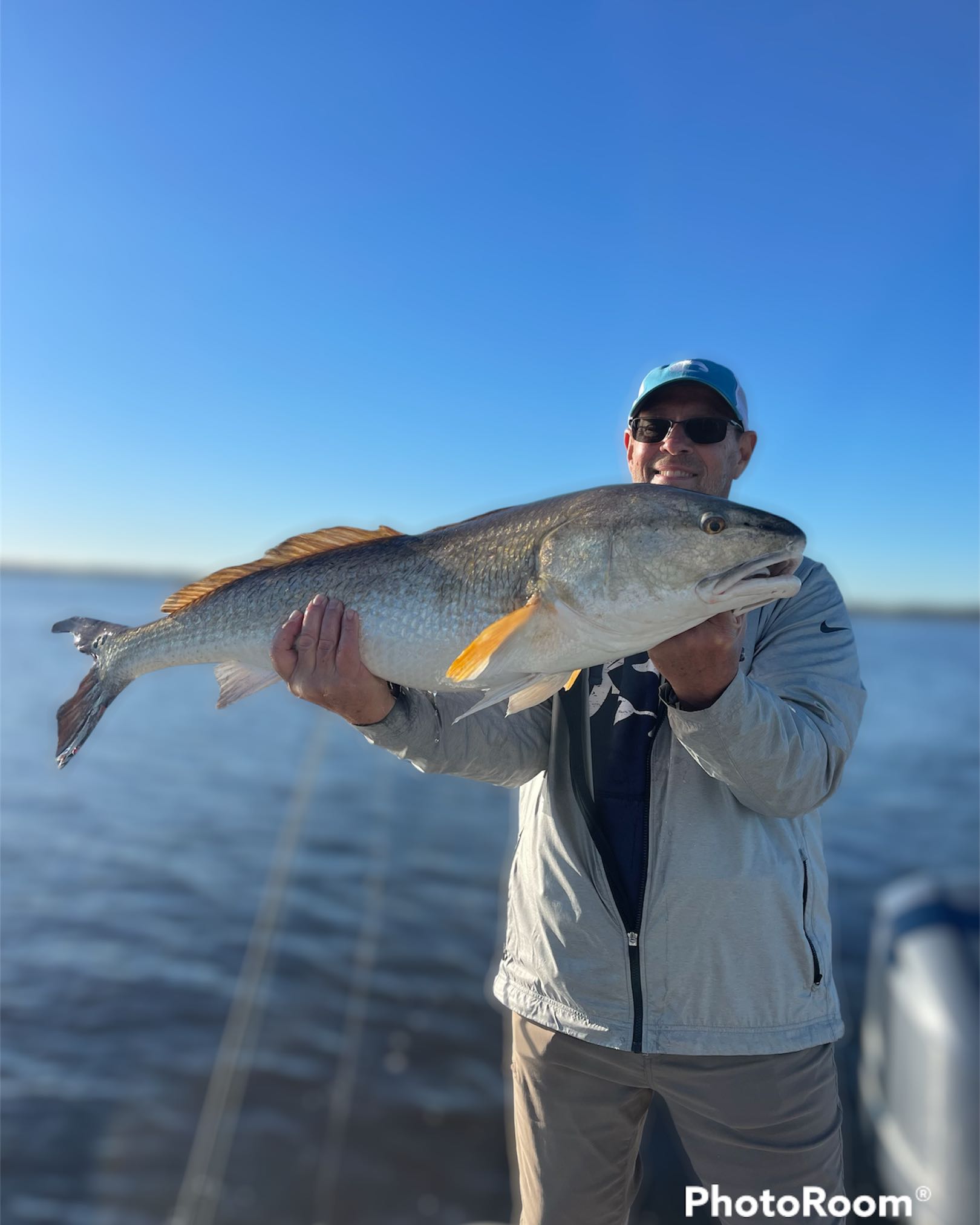 Angler with a fishing rod enjoying the sunshine at Jacksonville Beach