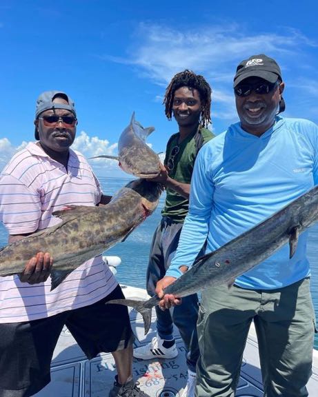 Three people fishing at Jacksonville Beach