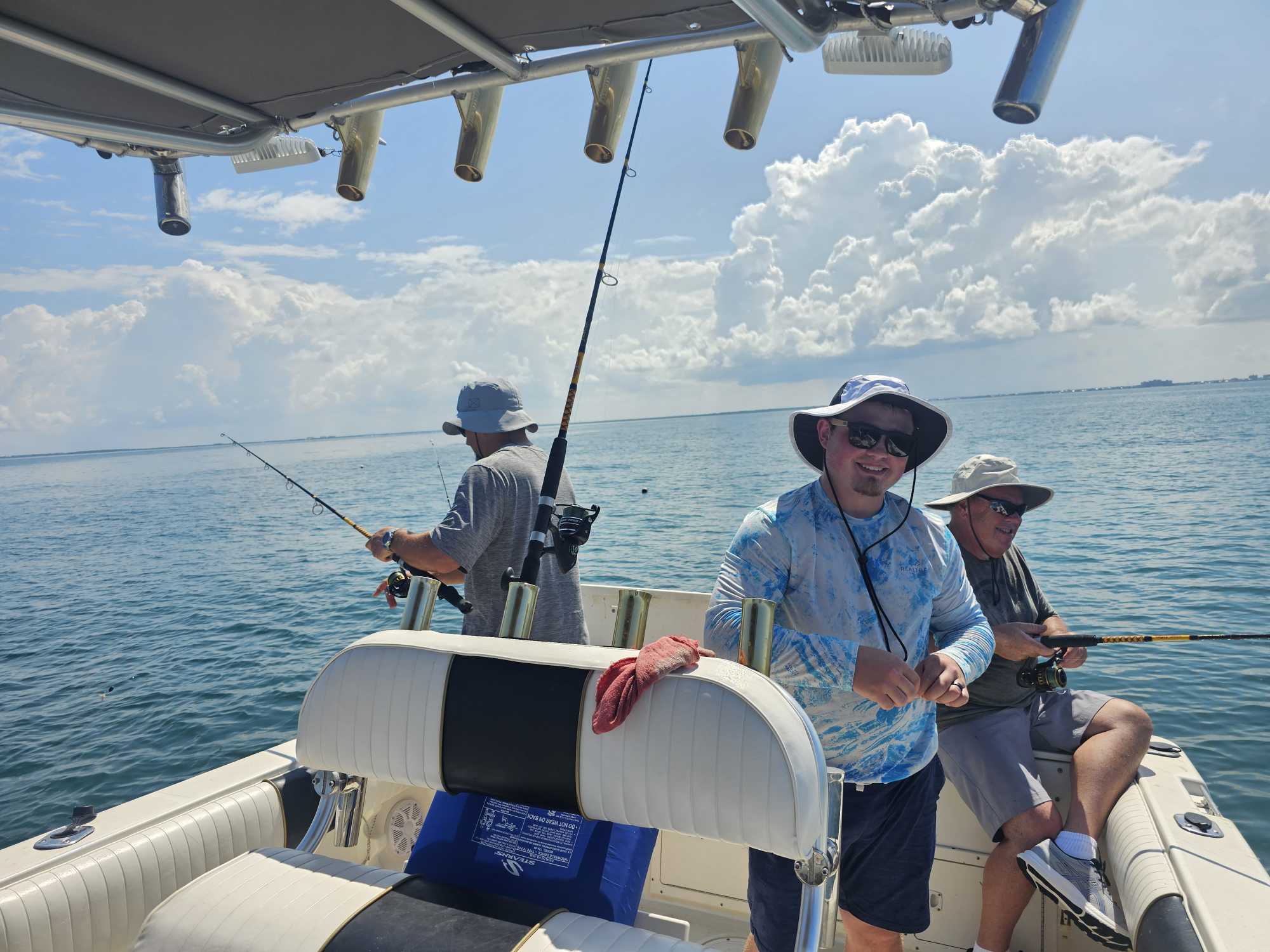 Two people fishing on the coast of FL