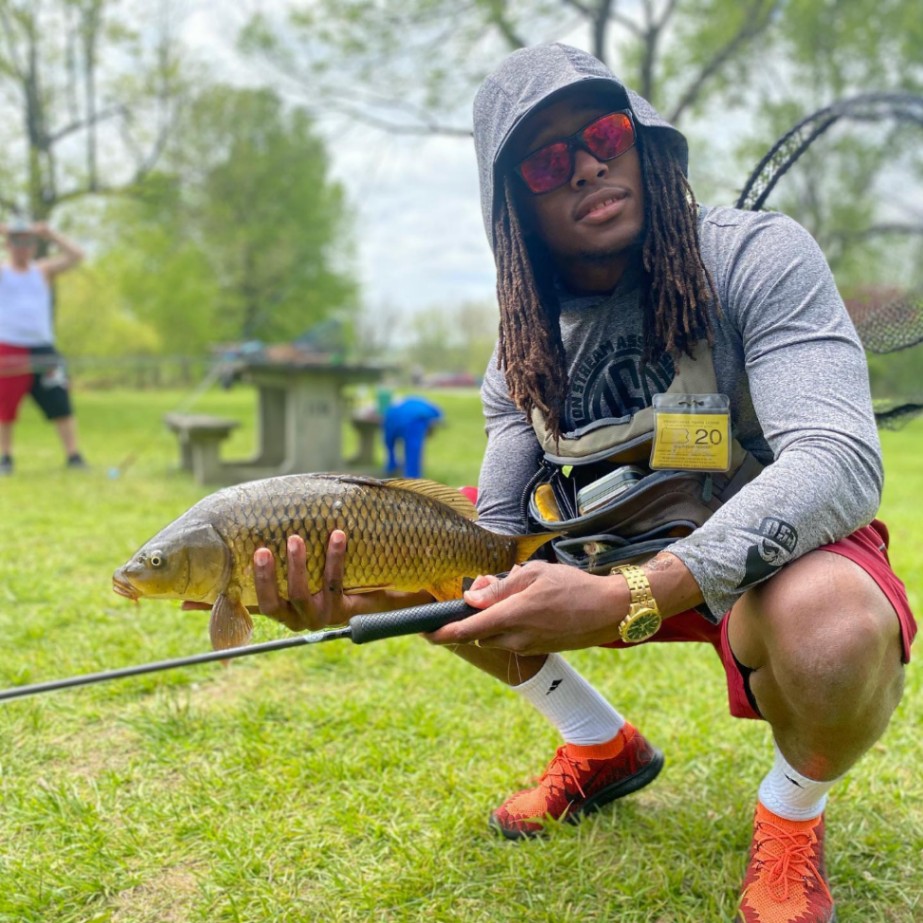 A person catching a common carp fish in Coatesville