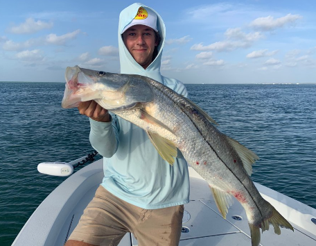 Angler holding a fishing rod on a holiday getaway