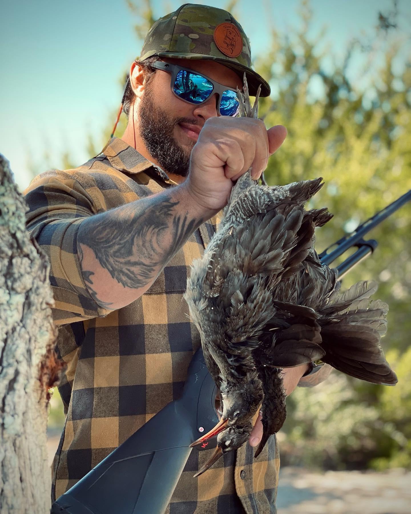 Charleston duck hunting guide in marsh with decoys and blind setup for teal and bufflehead hunting