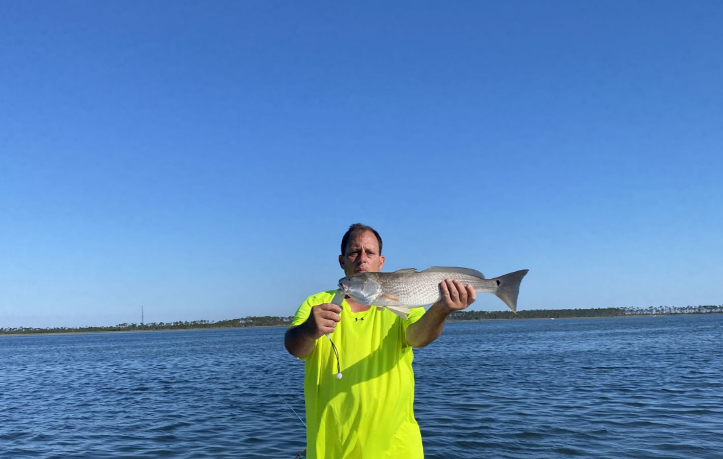 Angler holding 25-inch fish in FL