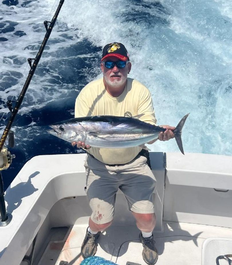 Yellowfin tuna being caught by two people in Kailua-Kona