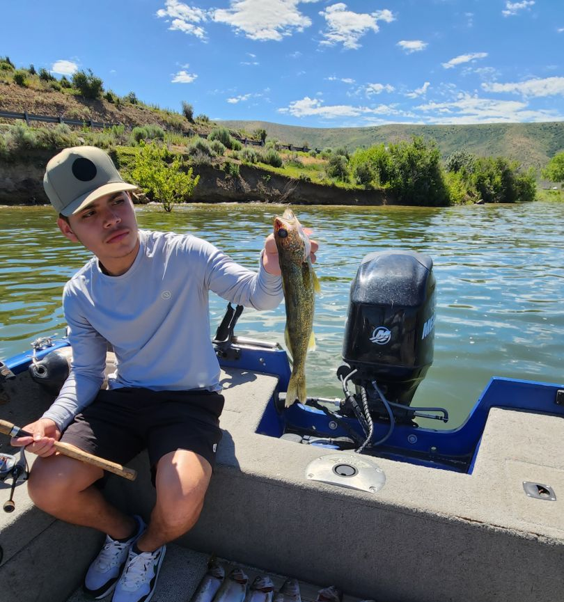 One fisherman holding a 13-inch catch in Duchesne