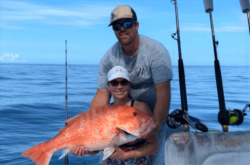 An angler catches a 26-inch fish in Grant-Valkaria