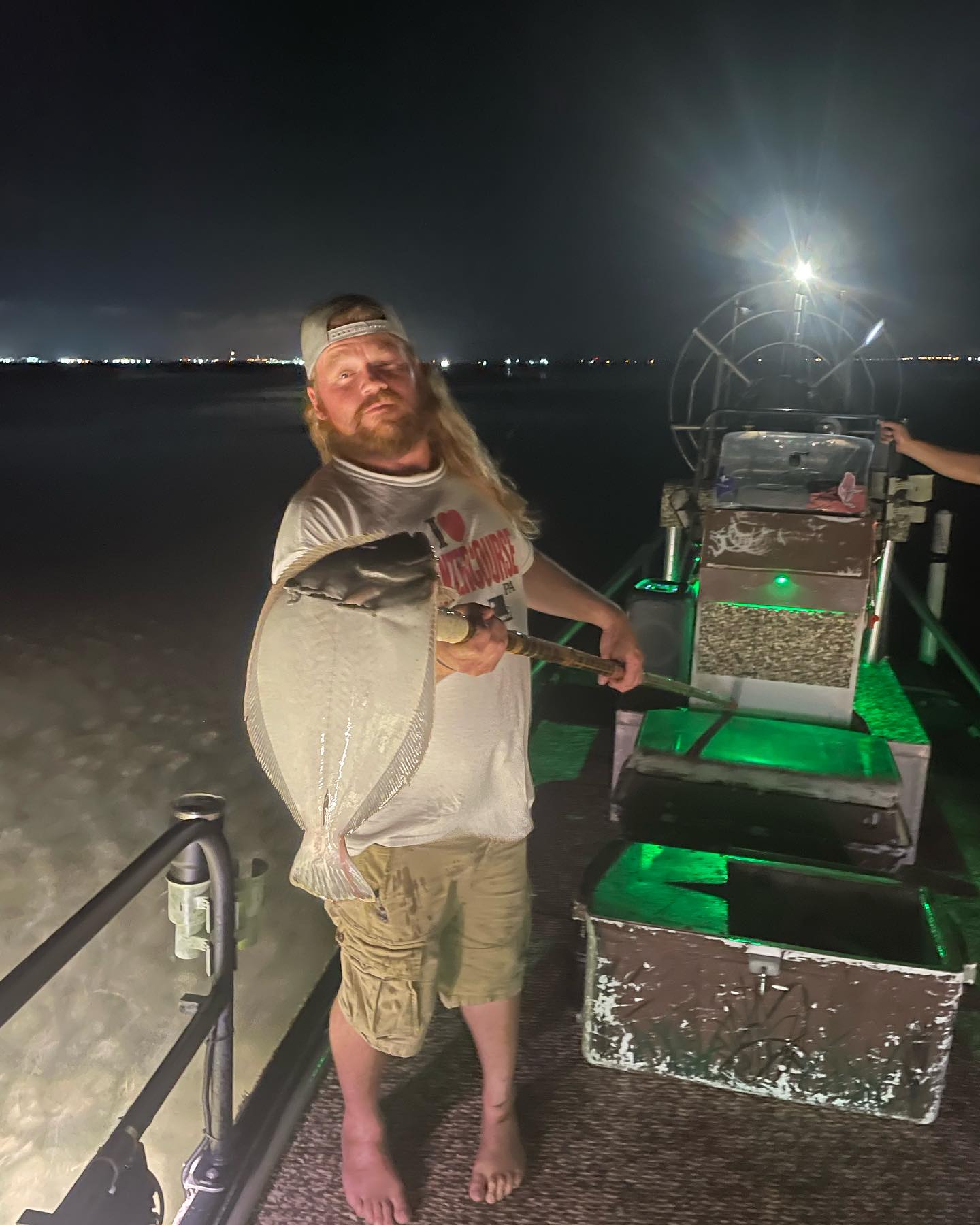 A lone angler fishing in the waters of Corpus Christi