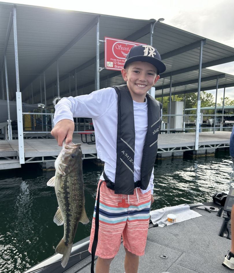 Spotted bass catch displayed at marina dock in Branson Missouri
