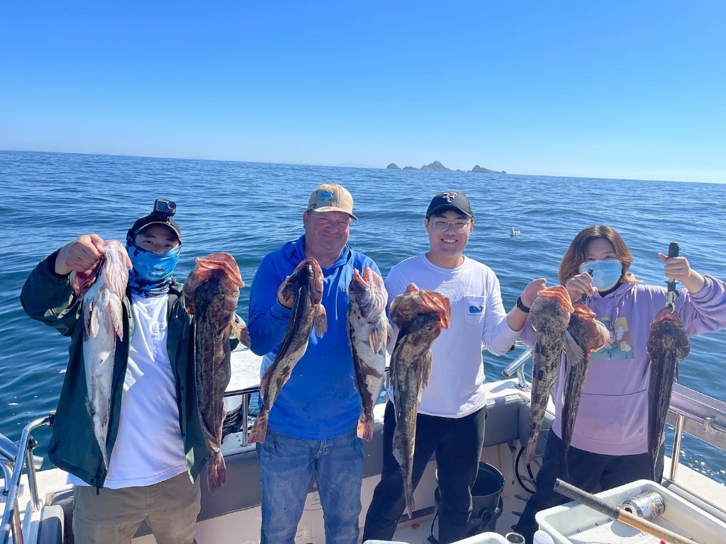 Group of 4 people fishing in California with 6 big fish caught
