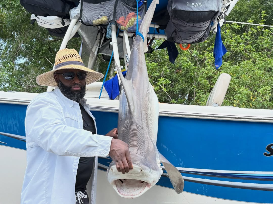 Large shark caught during fishing trip in Grant-Valkaria FL displayed on boat