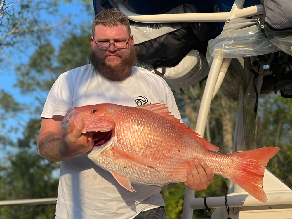 Red Snapper fishing charter boat offshore with anglers catching fish 15-35 miles out