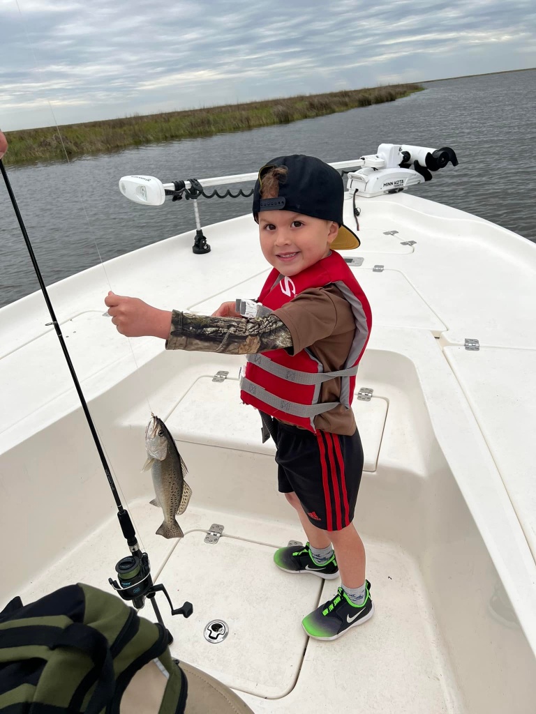 Lil man's 1st speckle trout. Louisiana fishing.