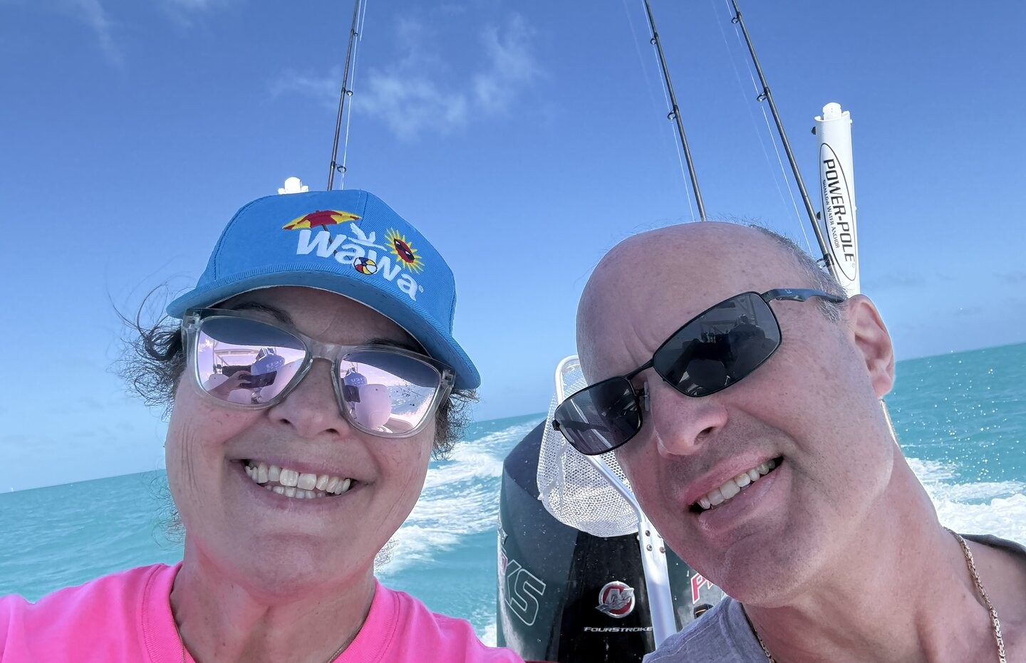 Fishing boat with outboard motor on turquoise waters in Key Largo FL