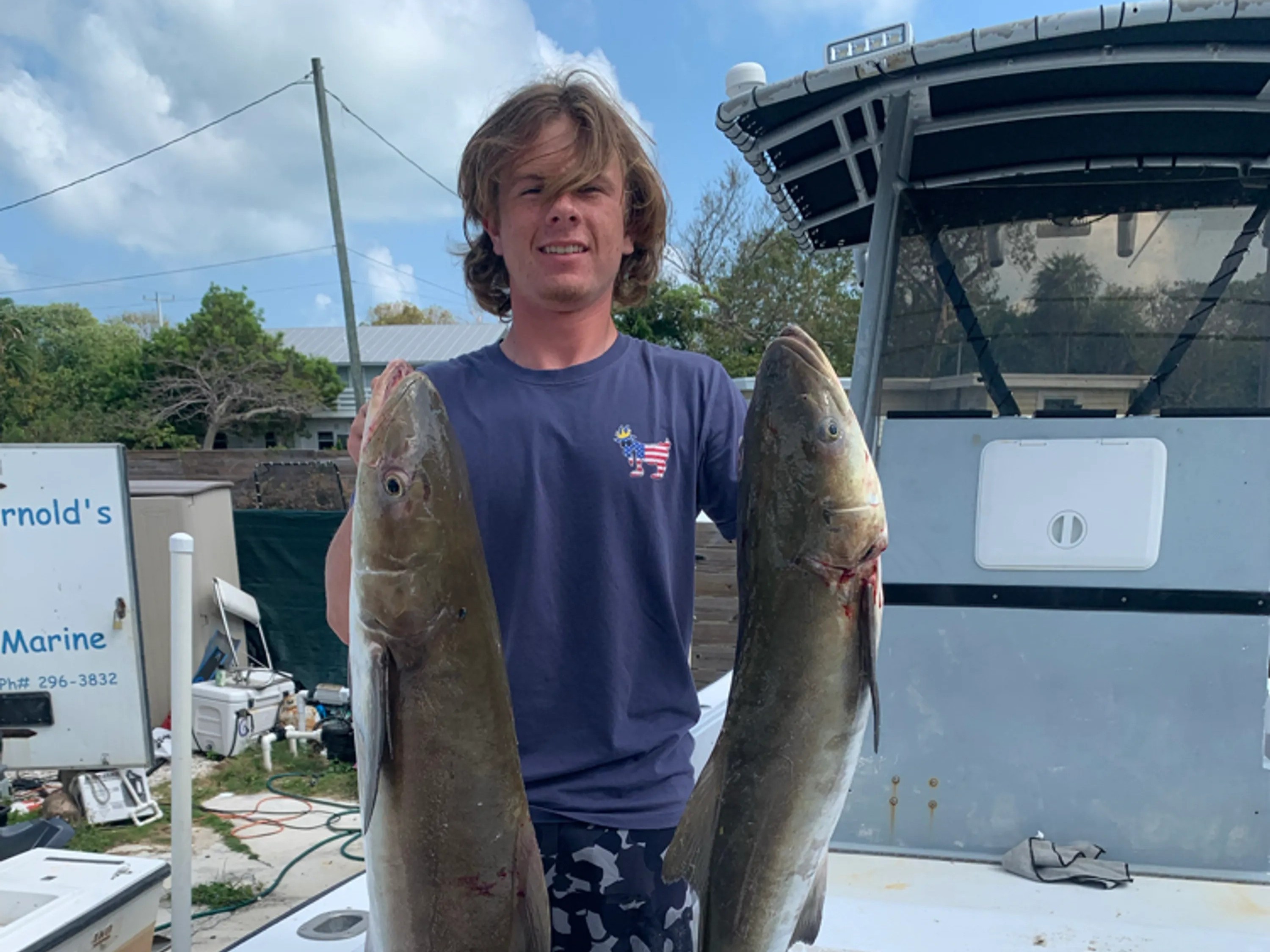 Offshore fishing boat in Florida Keys waters with anglers targeting grouper and snapper