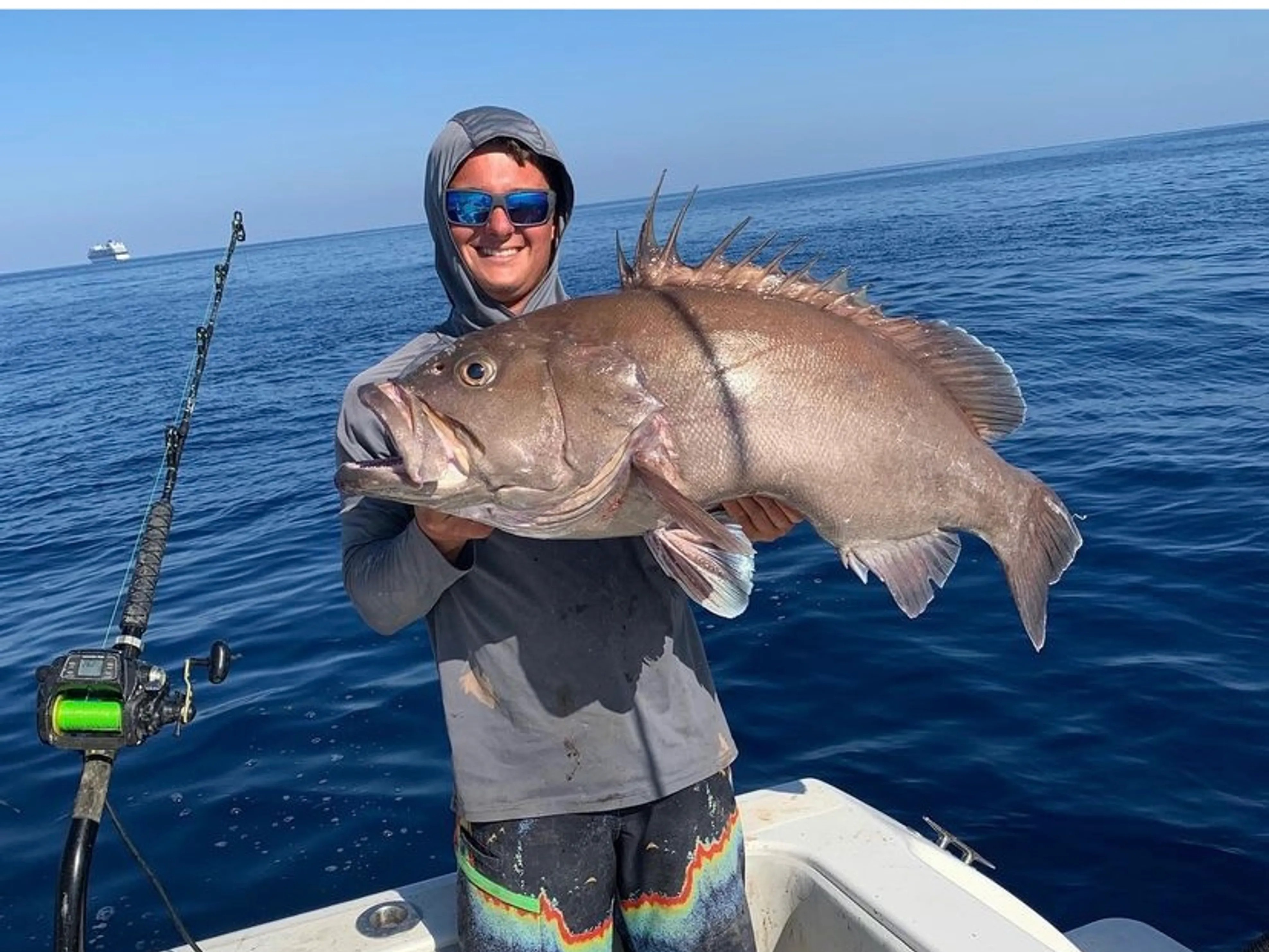 Florida Keys offshore fishing charter boat with anglers targeting grouper and mahi-mahi