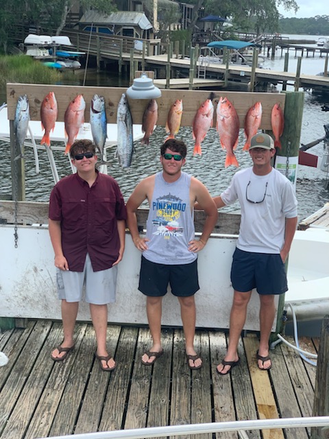 Red snapper fishing catch displayed on dock in Fort Walton Beach FL