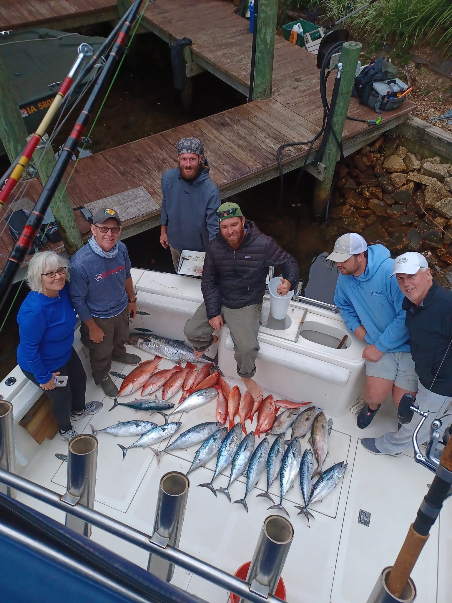 Fishing charter displaying fresh caught Little Tunny and King Mackerel on boat deck