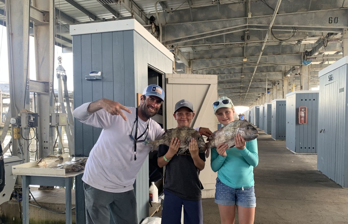 3 people enjoying a fishing trip in Galveston