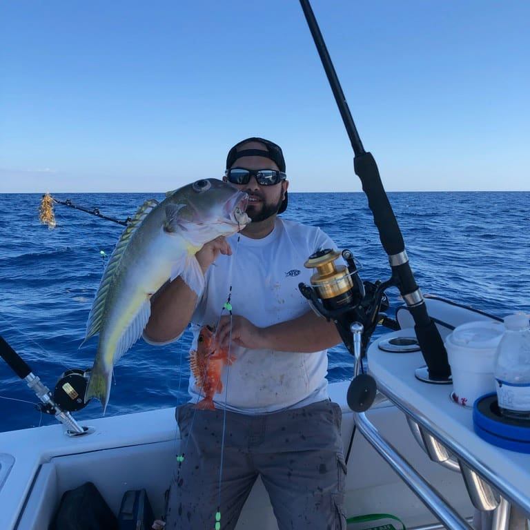 A lone angler reeling in a catch in Fort Lauderdale
