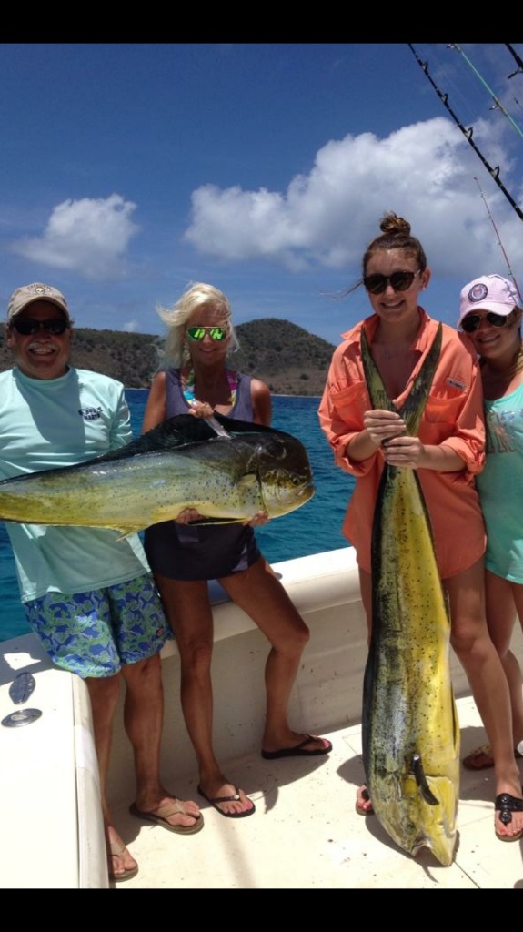 4 people fishing with 2 big fish on Wadmalaw Island
