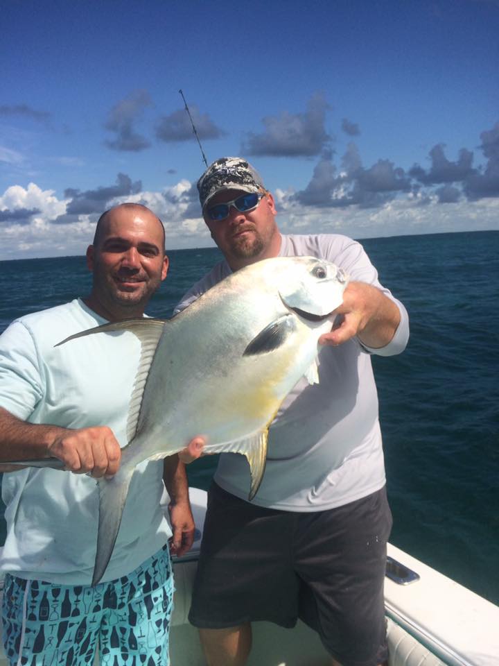 A permit fish caught in FL with two people fishing