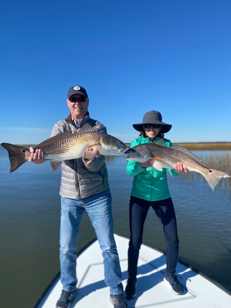 Two redfish caught by two anglers in Mount Pleasant