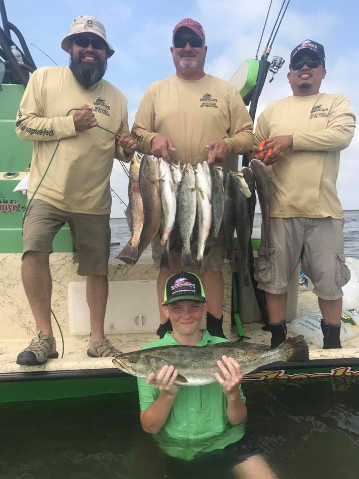 4 people fishing with 2 big fish in TX