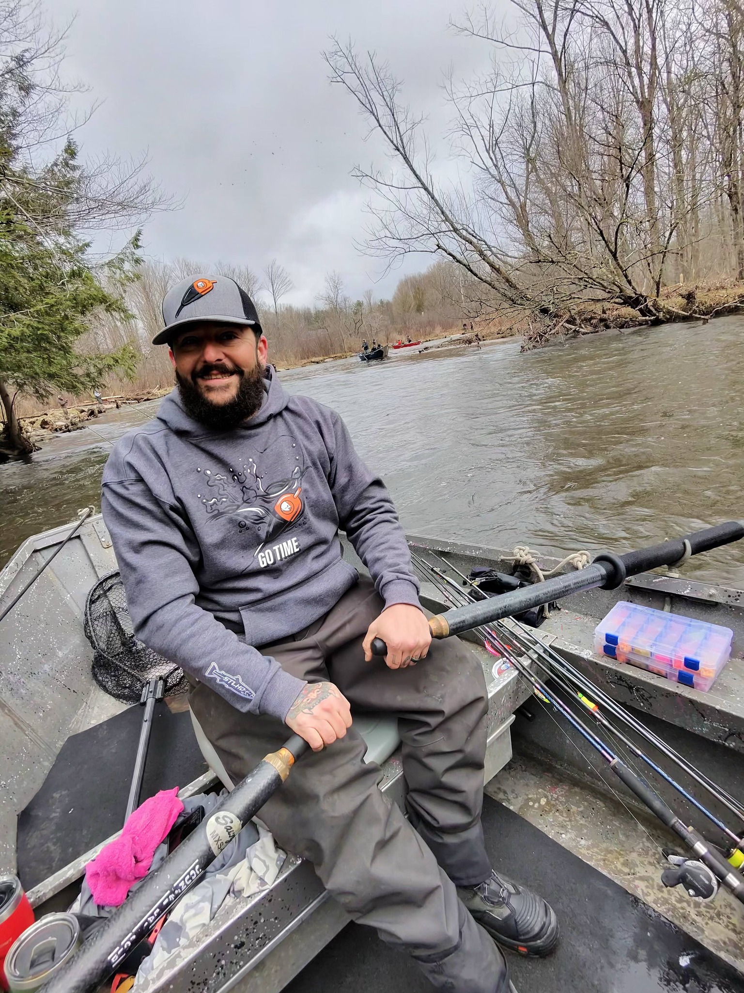 Fishing boat on river in Altmar NY with fishing rods and tackle box