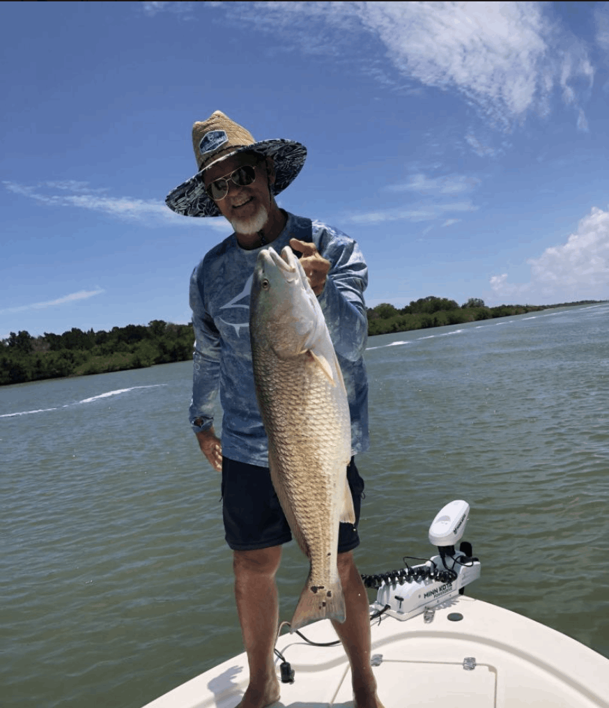 Angler with a 26-inch fish in Edgewater
