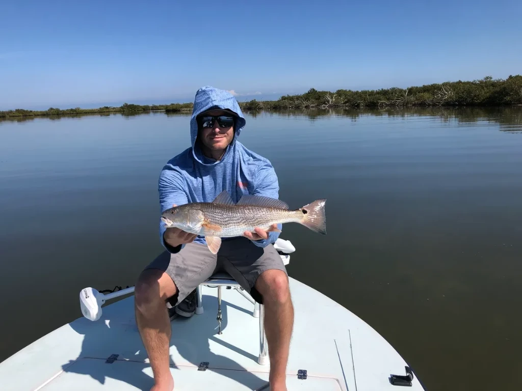 A person fishing with a rod in FL