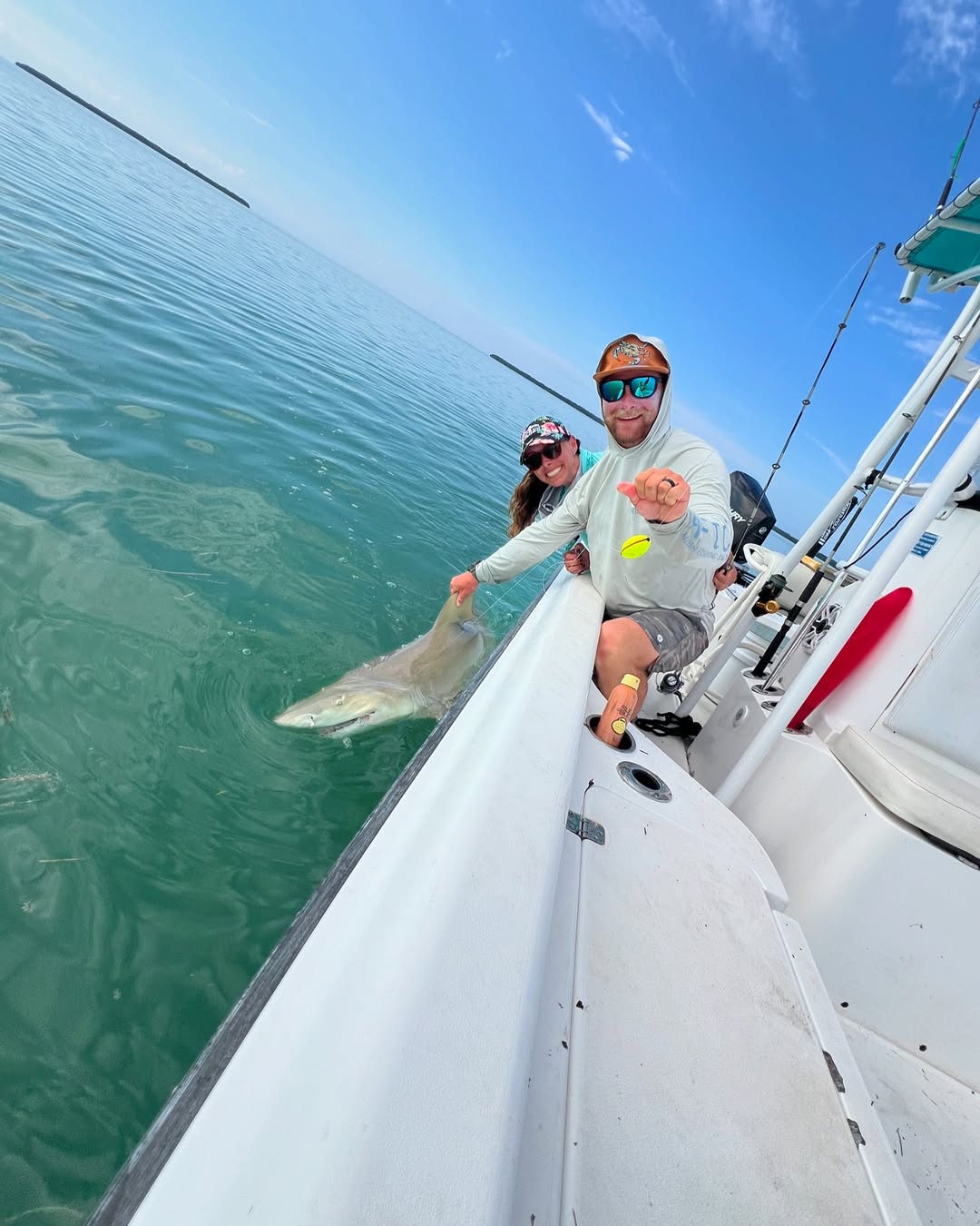 Two people fishing on the coast of FL