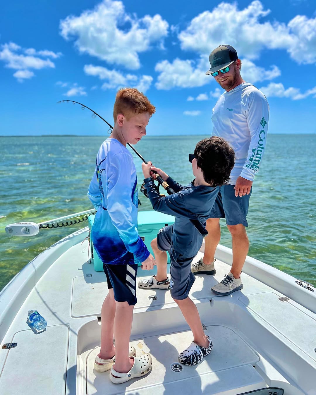 Florida Keys family fishing charter boat with kids catching snapper and tarpon inshore